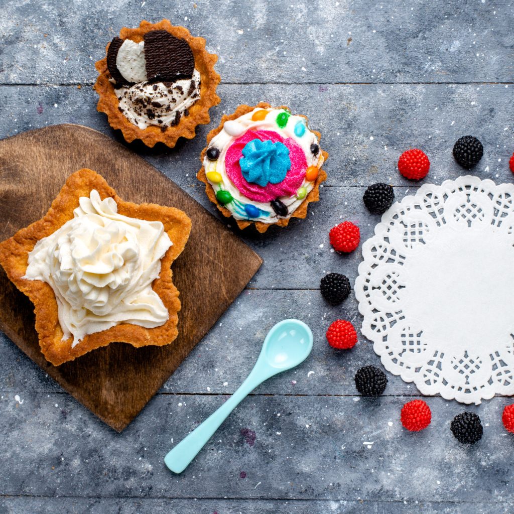 top view yummy creamy cake star shaped with cookie cakes berries blue spoon light background cake biscuit cream sweet tea